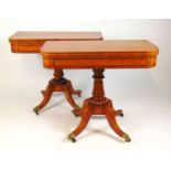 A pair of early 20th century satinwood and tulipwood banded card tables, the fold over top supported