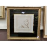 A gilt framed and glazed print of lady with dove