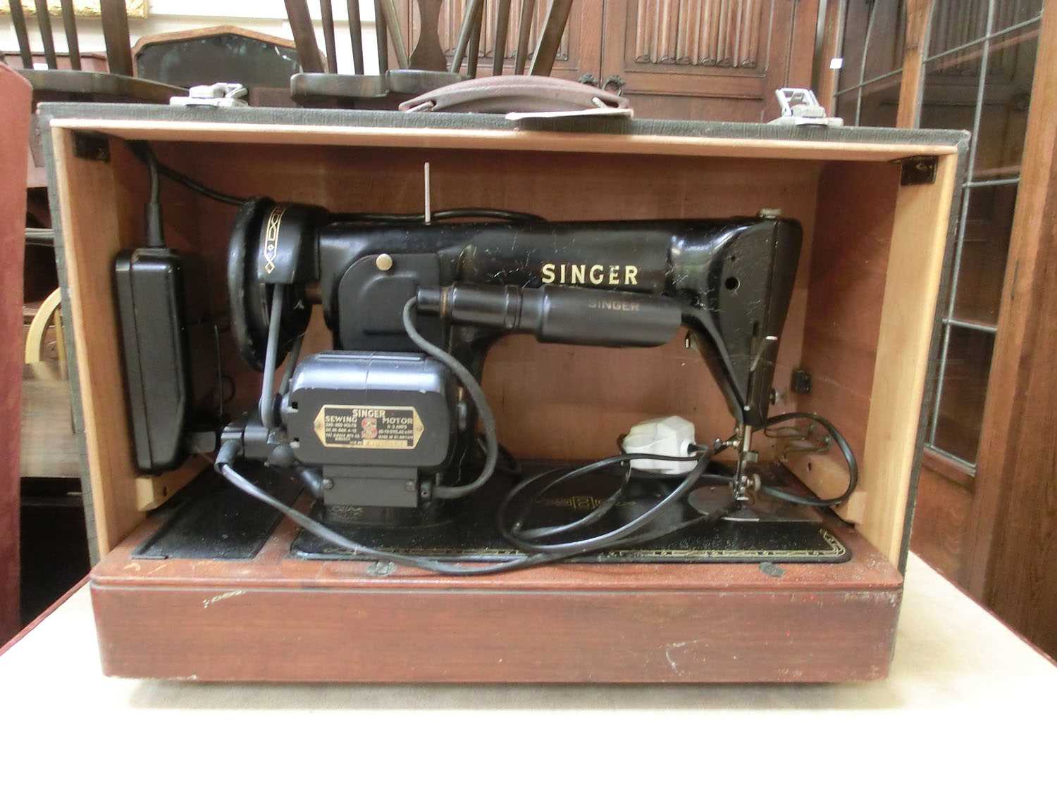 A cased electric Singer sewing machine