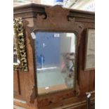 An early 20th century burr walnut Georgian style fretwork mirror