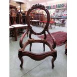 A 19th century mahogany framed nursing chair (Lacking upholstery)