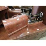 A Singer dome cased sewing machine