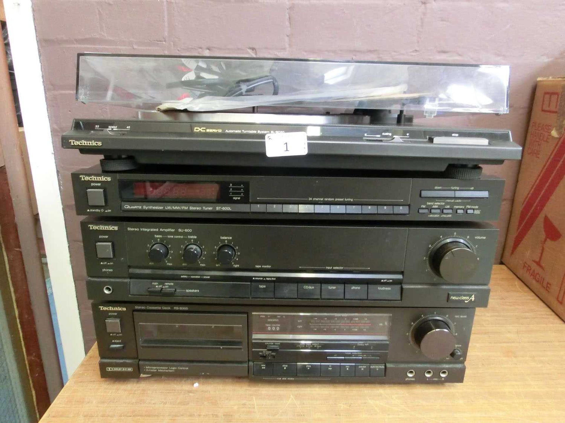 A Technics stacking hi-fi system, comprising of a stereo cassette deck, stereo integrated amplifier,