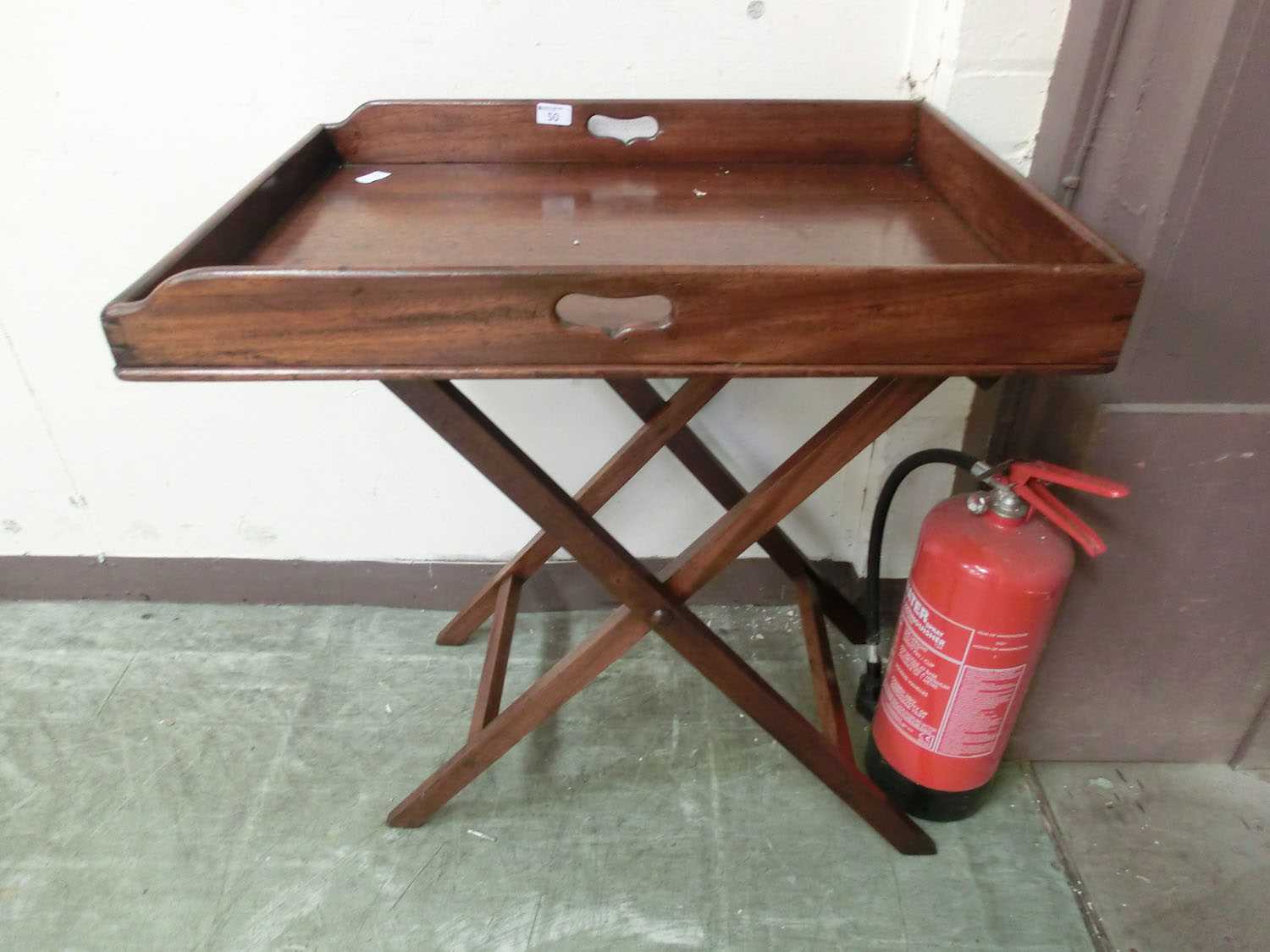 An 18th century mahogany butler's tray on stand