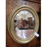 An early 20th century gilt wood oval mirror
