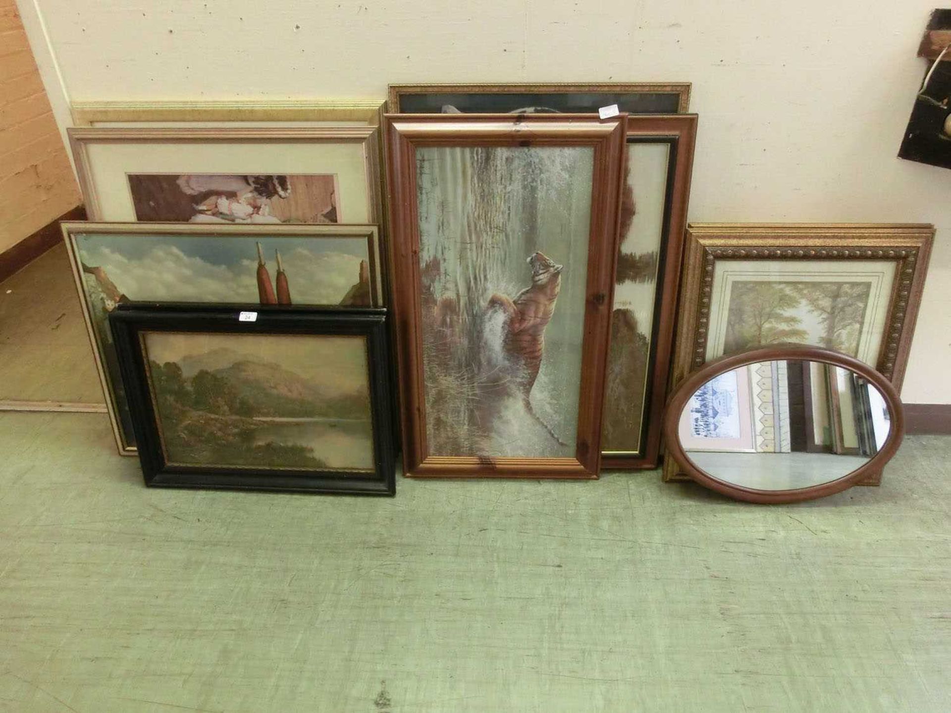 A large collection of artworks to include tigers, classical figures and lake scenes etc.