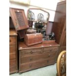 An early 20th century oak dressing chest having a mirrored back, the base having two short over