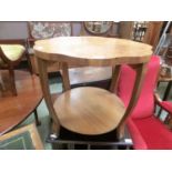 A 1930s walnut veneered scallop edged occasional table with under tierThe table is 51cm high and has