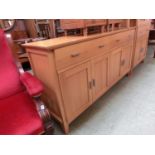 A modern oak sideboard, the top over two drawers and four cupboard doors