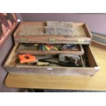 A toolbox containing a quantity of hand tools to include saws, spanners etc.