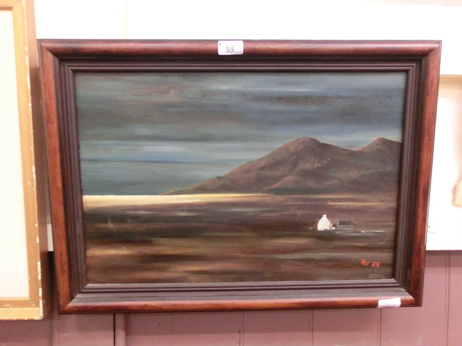 A framed oil on canvas of a cottage in coastal scene signed bottom right F W '86