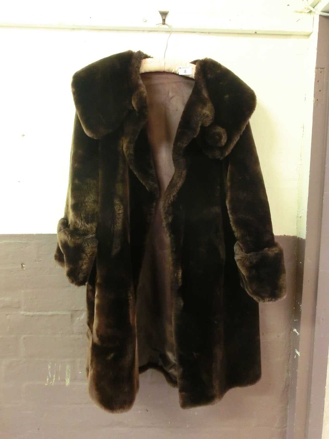 A brown faux fur coat