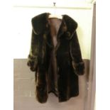 A brown faux fur coat