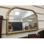 A gilt framed bevel glass over mantle mirror