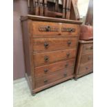 An early 20th century oak five drawer chest