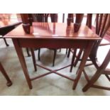 An early 20th century mahogany occasional table with a cross-member support to base