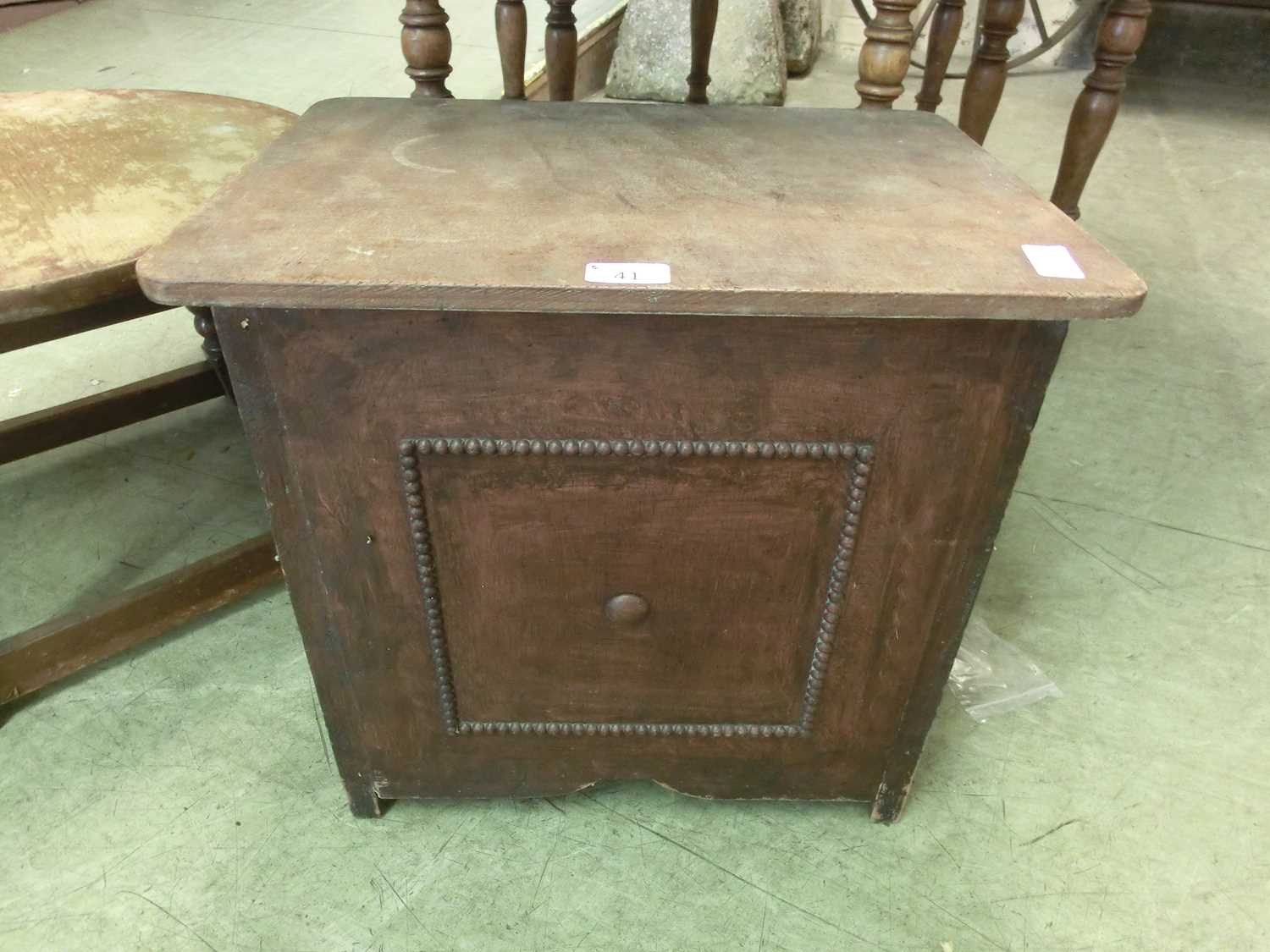 An early 20th century oak sewing box