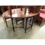 A mid-20th century oak gateleg table with barley twist supports