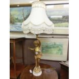 A marble based gilt cherub design table lamp