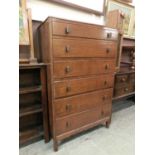 A mid-20th century oak chest of six long drawers
