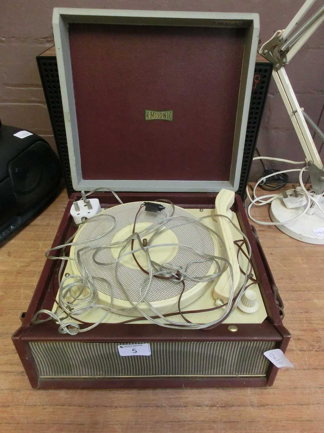 An Emisonic travelling record playing with a pair of speakers