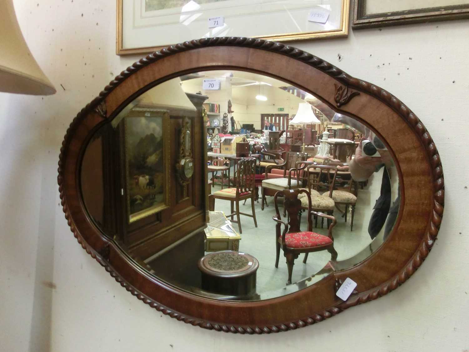 A walnut framed bevel glass mirror