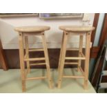 A pair of modern beech stools