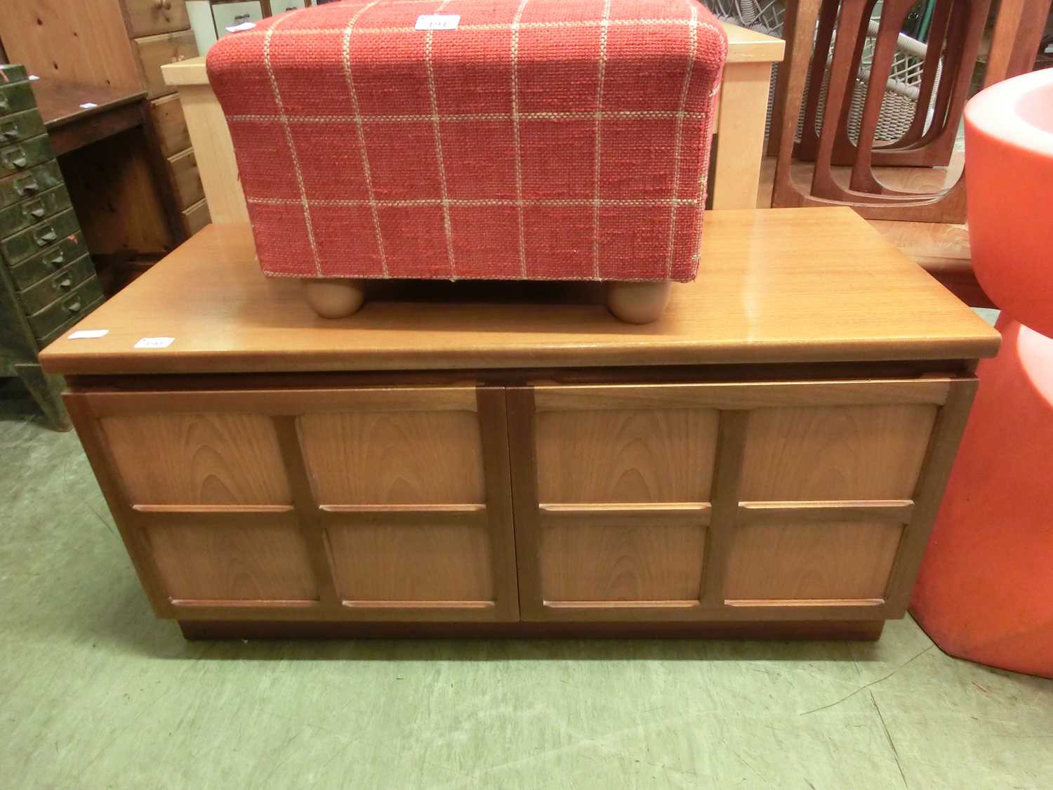 A mid-20th century teak two door cupboard