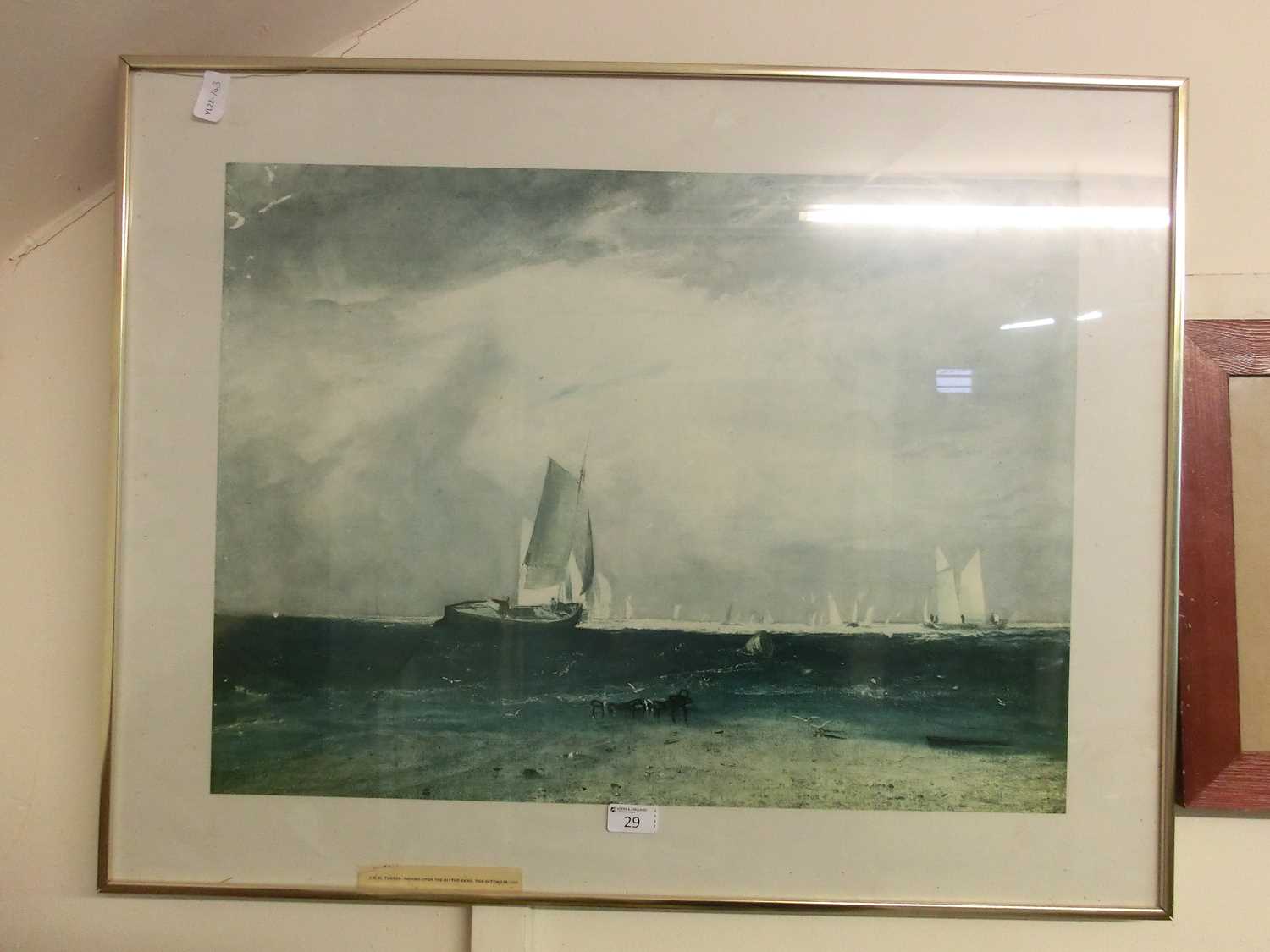 A framed and glazed print of sailing vessels after Turner