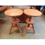 A pair of modern pine adjustable circular seated stools