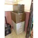 A green metal four drawer cabinet along with a green single drawer cabinet and a grey two drawer