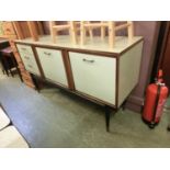 A mid-20th century design dresser base with a Formica top and drawer fronts