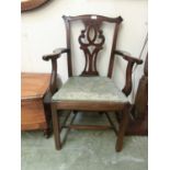 An early 20th century walnut framed open apu chair