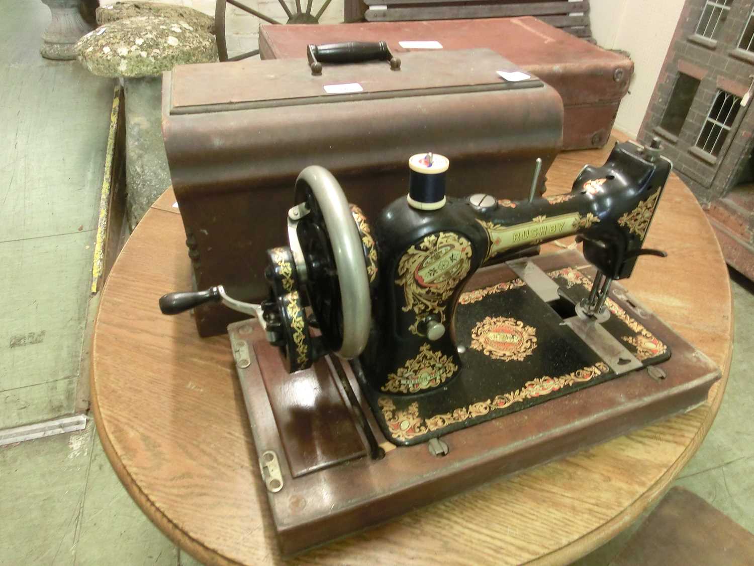 A walnut cased Rushby manual sewing machine