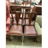 A set of four early 20th century high back dining chairs