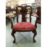 A Victorian walnut child's open armchair