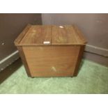 A mid-20th century teak sewing box with lift up lid