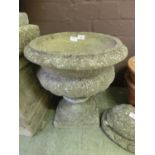 A composite stone garden urn