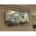 A mid-20th century bevel glass wall mirror