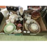 Two trays of ceramic ware to include cups, saucers, storage jars etc.