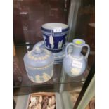 A selection of blue and white Jasperware to include plates, planters, twin handled vase etc.