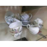 A part oriental tea set comprising of plates, cups, saucers, tea pot and sugar bowl