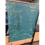 A laminated scroll map of England and Wales together with an oversize wooden compass and skipping