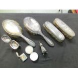 An assortment of silver hallmarked brushes, a vesta case, enamel topped box, etc