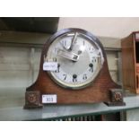 A mid-20th century Enfield oak cased mantle clock