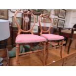 A pair of Victorian mahogany bedroom chairs with spindle backs