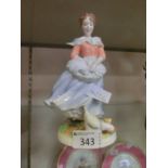 A Royal Worcester figurine 'Old Country Ways a Farmer's Wife'