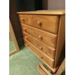 A modern pine chest of four drawers