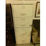 A white painted wooden four drawer filing cabinet