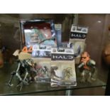 A collection of collector's figurines to include Halo, Hatsune Miku, etc